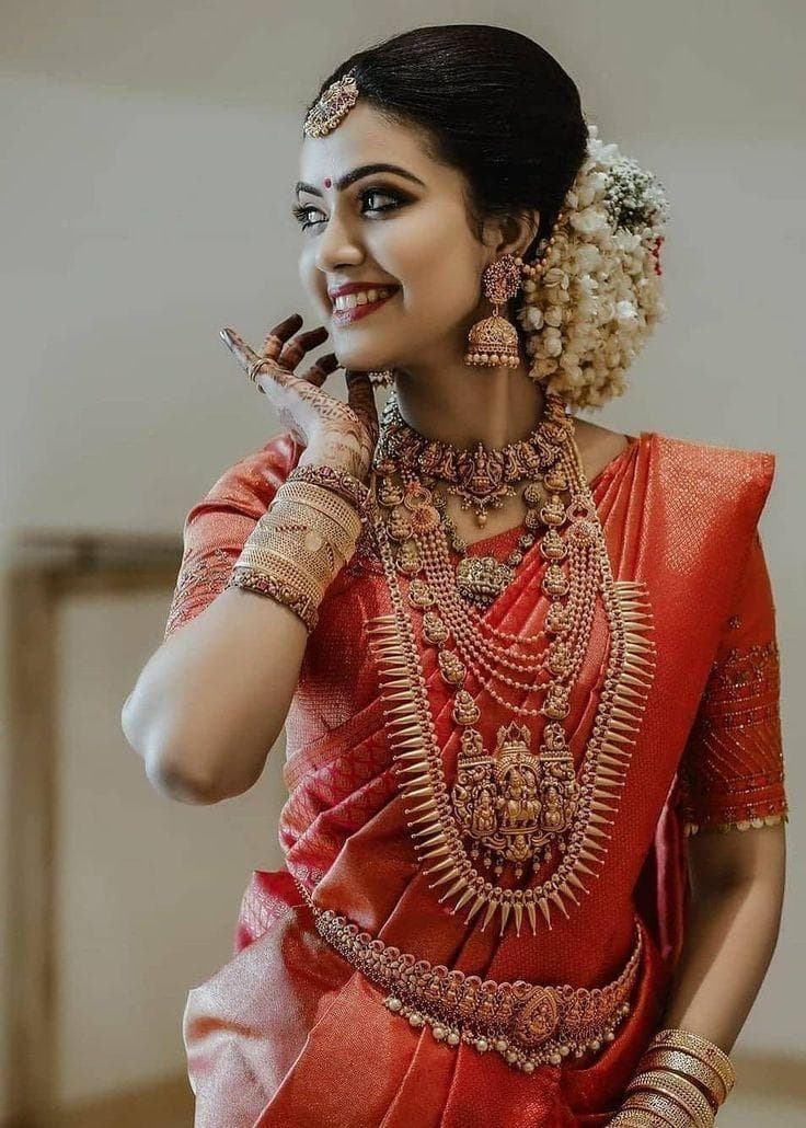Traditional red saree South Indian bridal jewellery