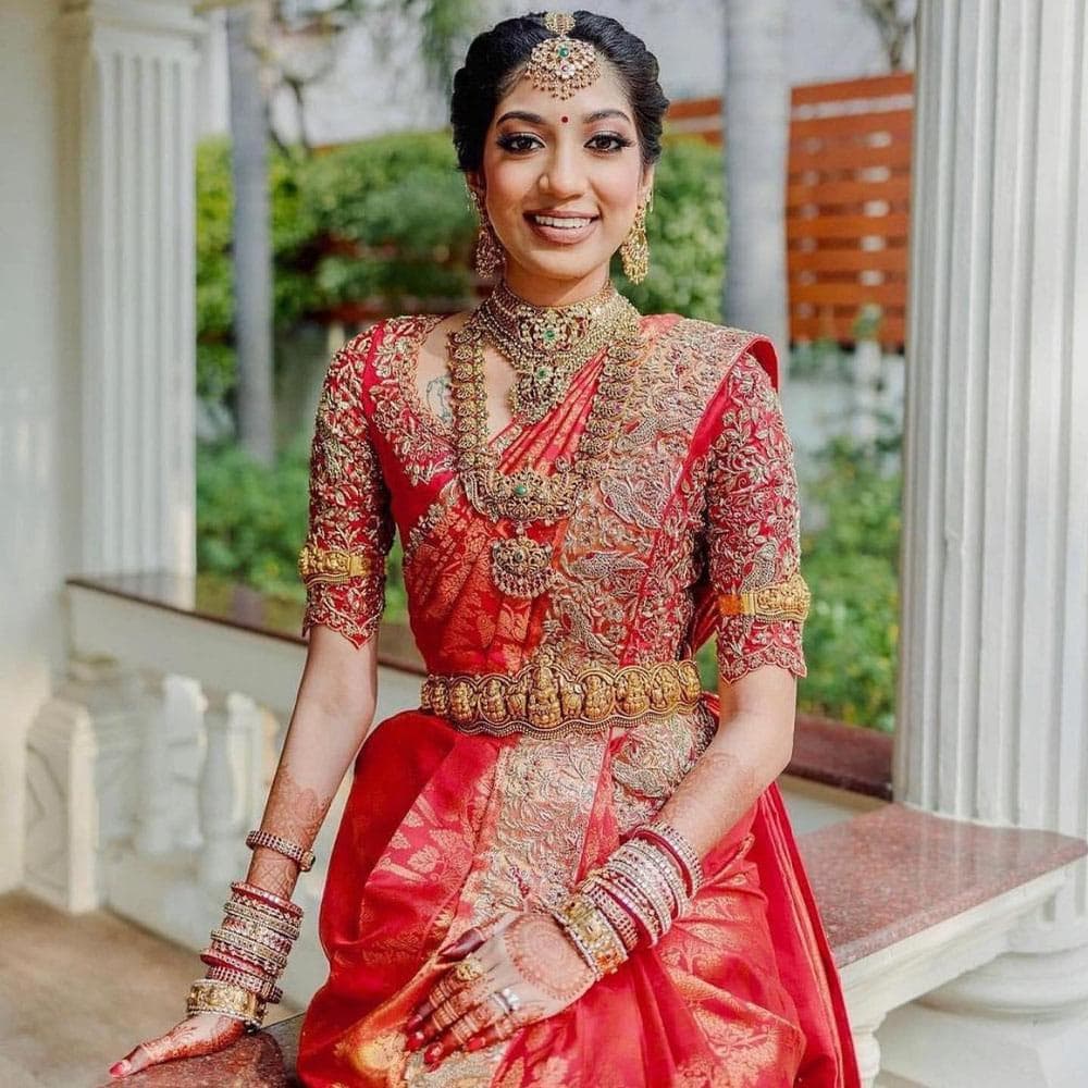 South Indian bride standing in traditional bridal wear